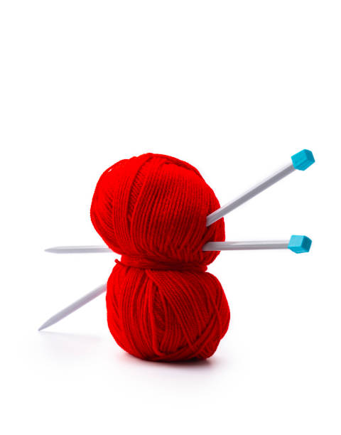 istock Red ball of wool with knitting needles 1874143275
