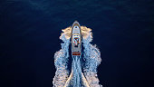 Yacht cruising fast in sea