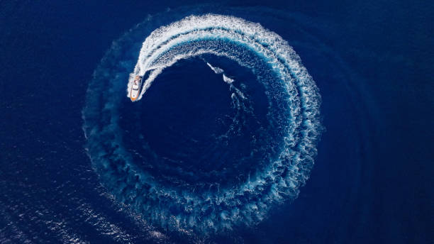 Yacht cruising fast in sea Aerial view of luxury yacht moving fast at Adriatic sea during sunny day. sea wake stock pictures, royalty-free photos & images
