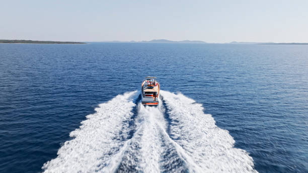 istock Man sailing yacht over ocean 1874145864