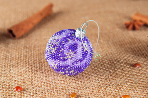 Exquisite handmade Christmas bubble toy from beads, also known as a Christmas globe or Christmas bulb, is a part of holiday decor
