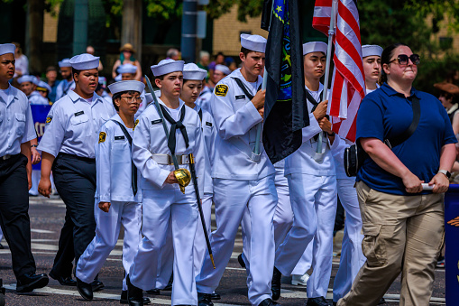 Portland, Oregon, USA - June 10, 2023: United States Naval Sea Cadet Corps in the Grand Floral Parade, during Portland Rose Festival 2023.