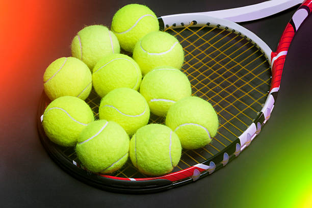 istock Balls on Tennis Racquet Strings against Black background 187416807