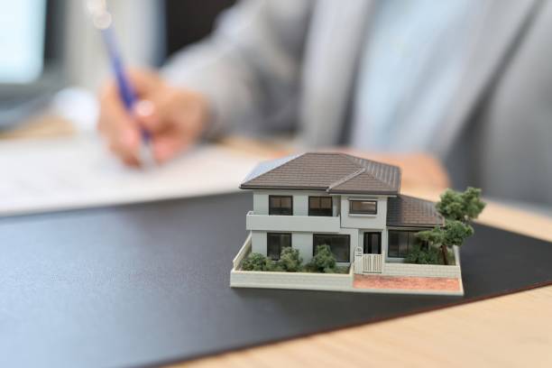 istock A woman signing a real estate contract 1874174342