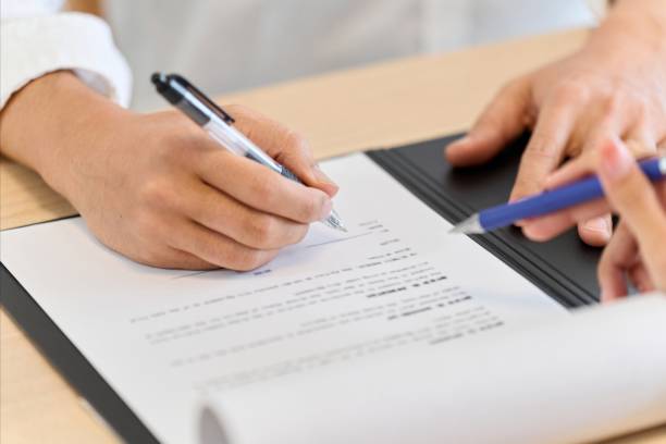 istock A man signing a real estate contract 1874175198