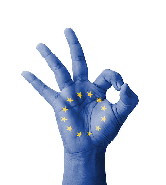 Hand making Ok sign, EU (European Union) flag painted stock photo