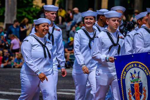 Portland, Oregon, USA - June 10, 2023: USS John S. McCain (DDG-56) crew in the Grand Floral Parade, during Portland Rose Festival 2023.