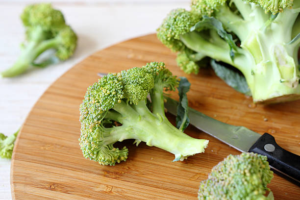 istock fresh broccoli on a cutting board and knife 187420255
