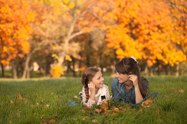 istock Mother and daughter in a autumn park. 187420373
