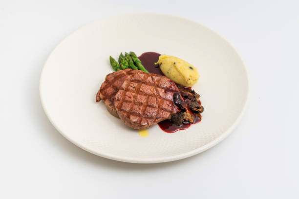 istock Thinly sliced grilled tenderloin on white background 1874205893