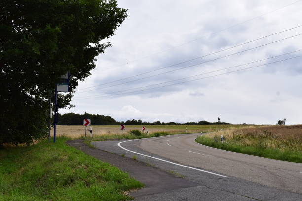 istock country road curve between field 1874205951