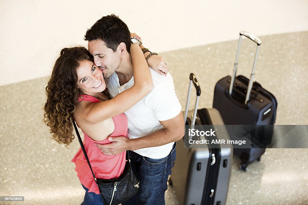 Couple embraced at airport. They are so happy to see each other! Airport Stock Photo