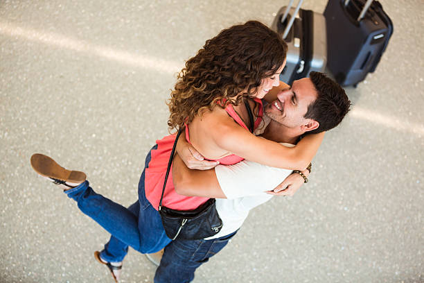 istock Couple embraced at airport. 187421847
