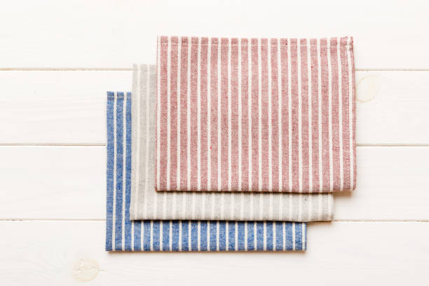 istock top view with red empty kitchen napkin isolated on table background. Folded cloth for mockup with copy space, Flat lay. Minimal style 1874221137