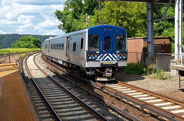 istock Commuter railroad train passing station, Bronx, New York City 187423205