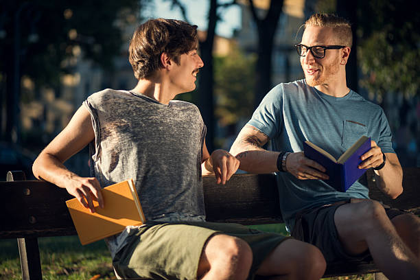 istock Guys Reading at the Park 187424595