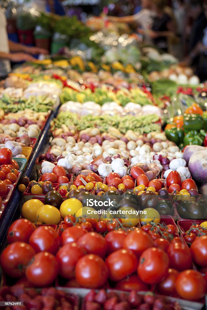 Assortment of Vegetables at Farmers Market A Wide Assortment of Vegetables at Farmers Market, with fresh tomatoes and garlic Agricultural Fair Stock Photo