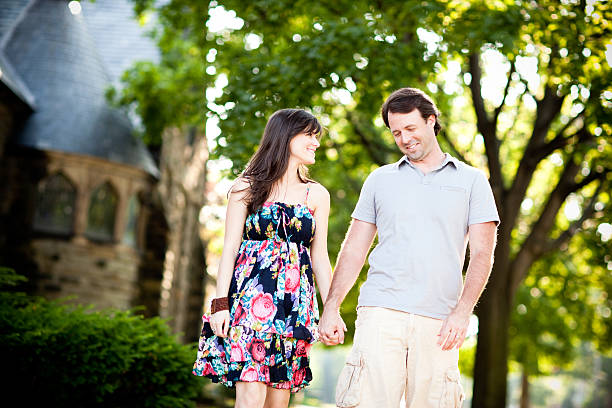 istock Happy Couple Walking Outdoors Together on Summer Day 187425719