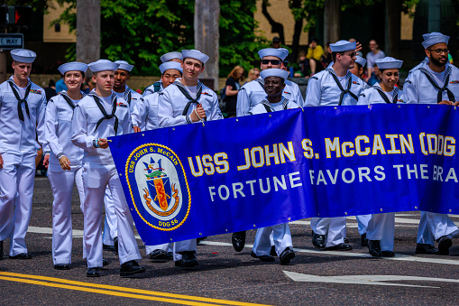 Portland, Oregon, USA - June 10, 2023: USS John S. McCain (DDG-56) crew in the Grand Floral Parade, during Portland Rose Festival 2023.