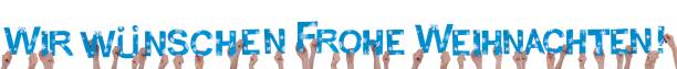 istock People Holding We Wish a Merry Christmas 187427338
