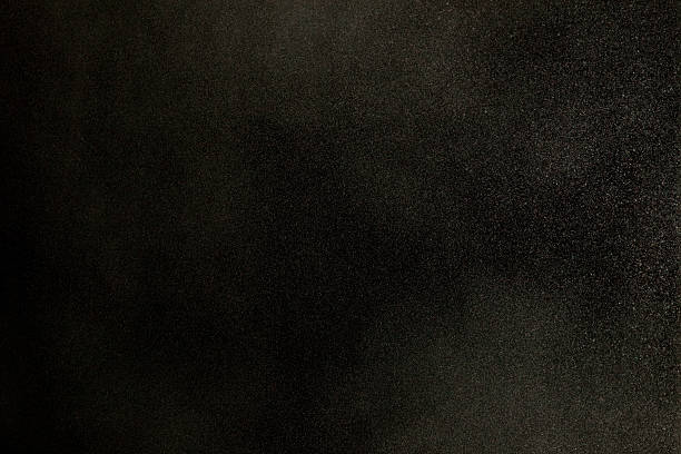 Texture of dust in the wind over black background