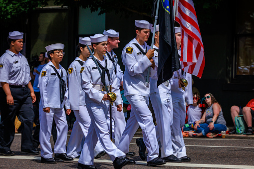 Portland, Oregon, USA - June 10, 2023: United States Naval Sea Cadet Corps in the Grand Floral Parade, during Portland Rose Festival 2023.