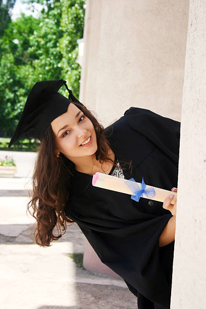 istock Young student in gown near the university 187429314