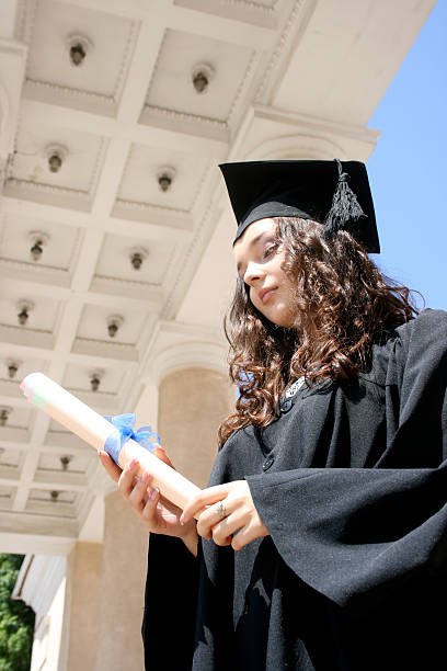 istock Young student in gown near the university 187429345