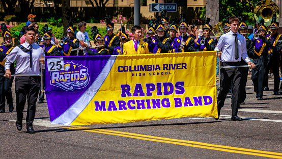 San Antonio, Texas, USA - April 8, 2022: The Battle of the Flowers Parade, The Tom C. Clark High School Cougar Band performing at the parade