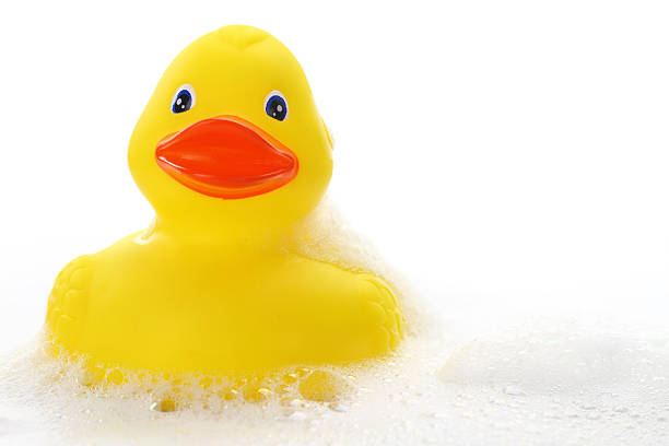 istock Yellow rubber duck in bath foam 187429710