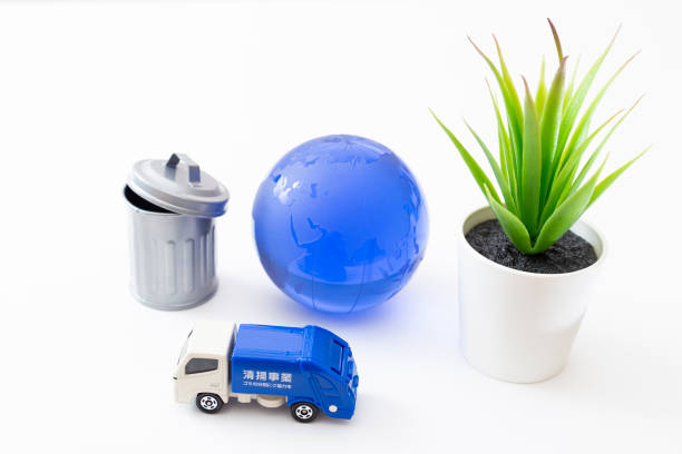 istock Garbage truck, trash can and earth. 1874310735