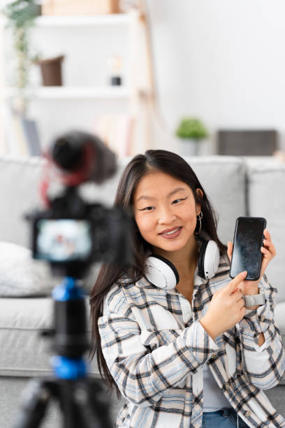 istock Chinese influencer recording an online tutorial at home 1874327277