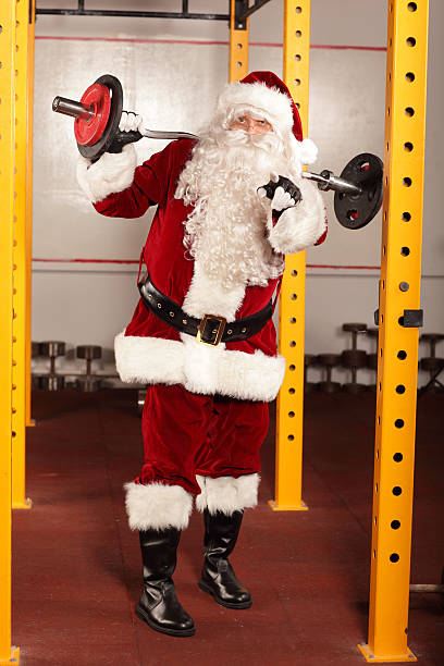istock Santa Claus with weights in gym - training before Christmas 187433903