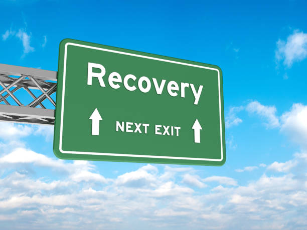 istock Road Sign with RECOVERY on Sky 1874347412