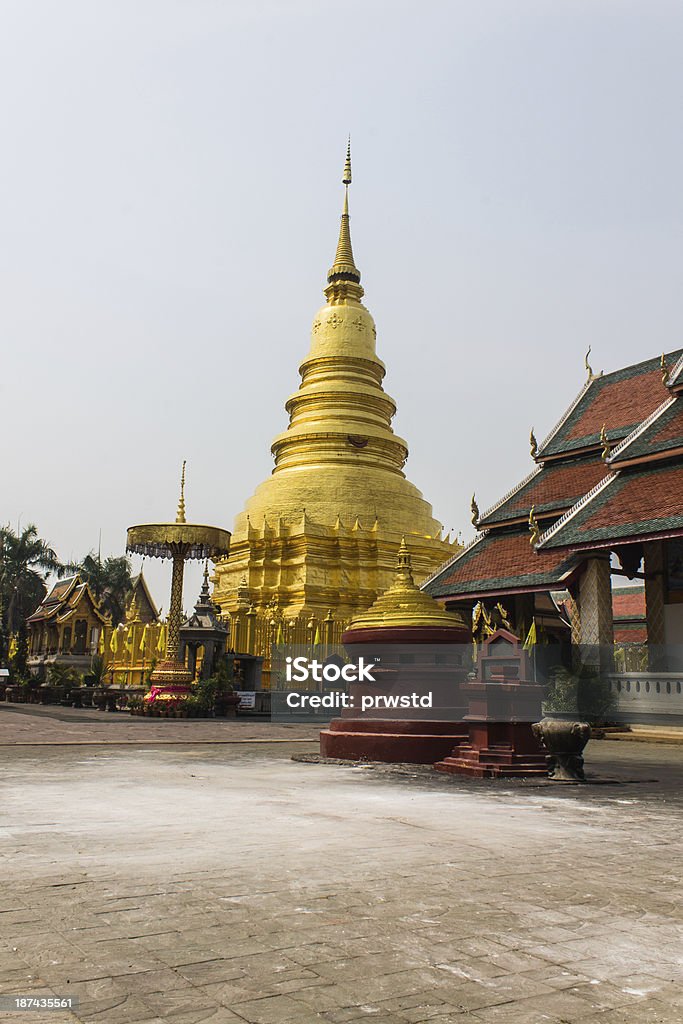 Phra That Hariphunchai golden Chedi which is a major place of worship, Phra That Hariphunchai Architecture Stock Photo