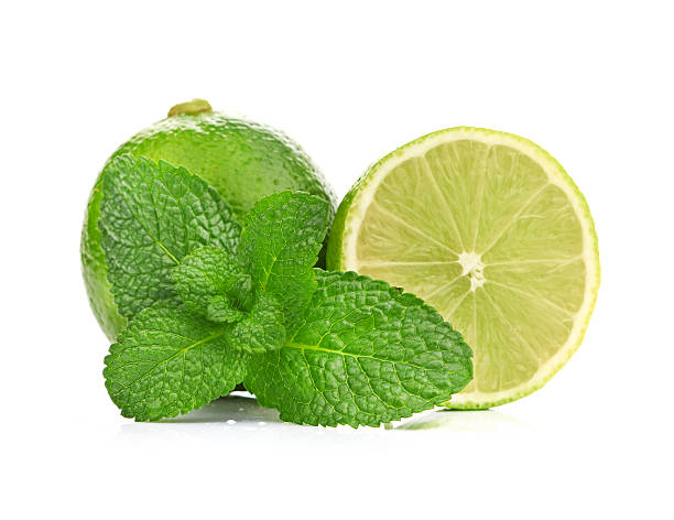 istock Limes and mint isolated on white background 187436541