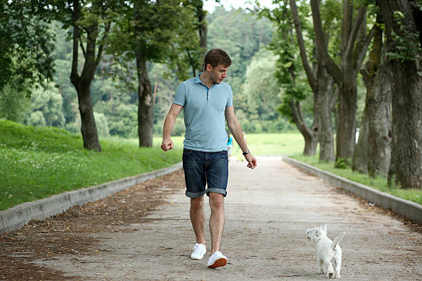 istock Young man running with your dog 187438177
