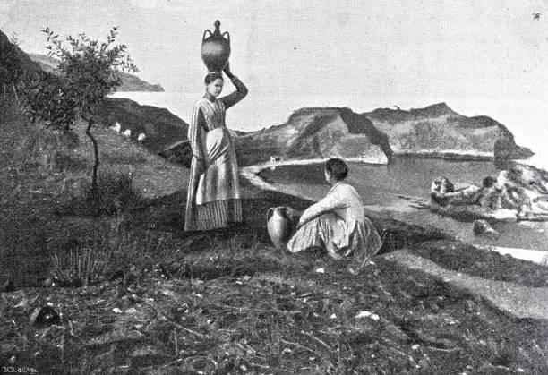 istock Two women with water jugs near Taormina, cap Andrea 1874386027