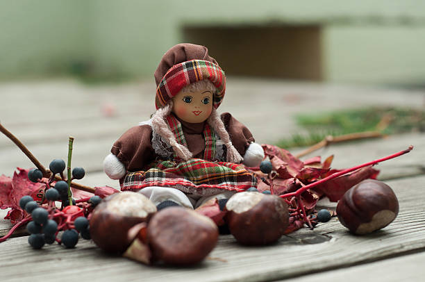 Toy doll with autumn decoration