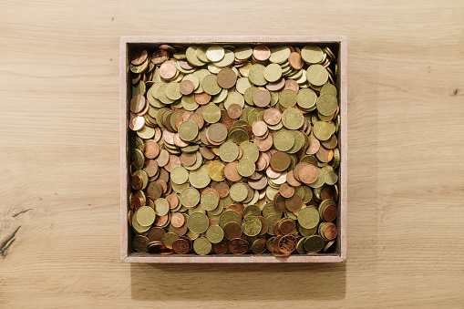 A large box filled with coins