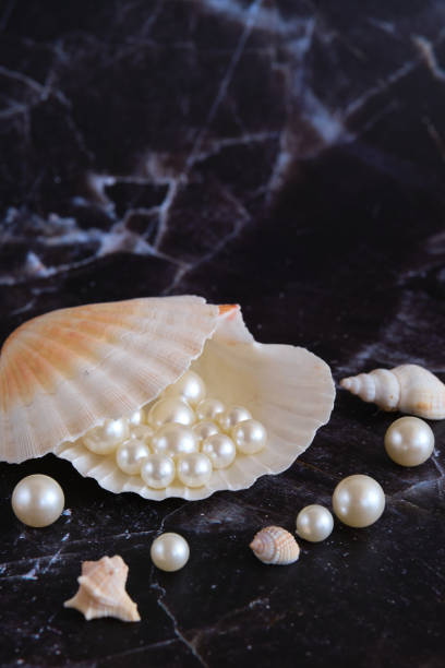istock a few pearls in a sea shell 1874404395