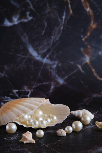 istock a few pearls in a sea shell 1874406015
