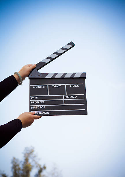 clapper board with hand stock photo