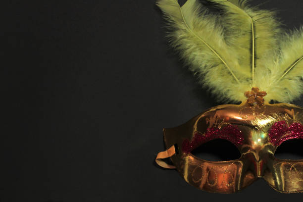 istock Gold and green mask with carnival feathers 1874428335