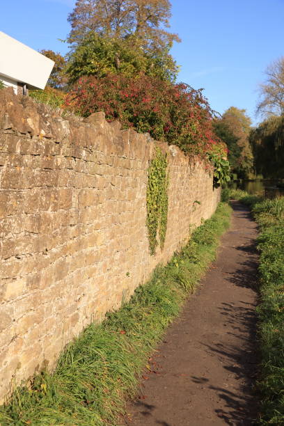 istock Footpath next to the wall Guildford Surrey England 1874432248