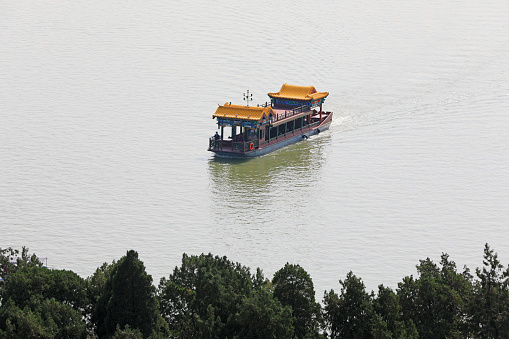 A cruise ship runs in Kunming Lake of the summer palace, Beijing, China