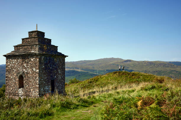 Dun Na Cuaiche Inveraray, Argyll, Scotland, UK. 7th September 2023. Looking south, a young couple admire the view across Loch Fyne after the climb to Dun Na Cuaiche watchtower at Inveraray. Argyll and Bute. Scotland. loch fyne stock pictures, royalty-free photos & images
