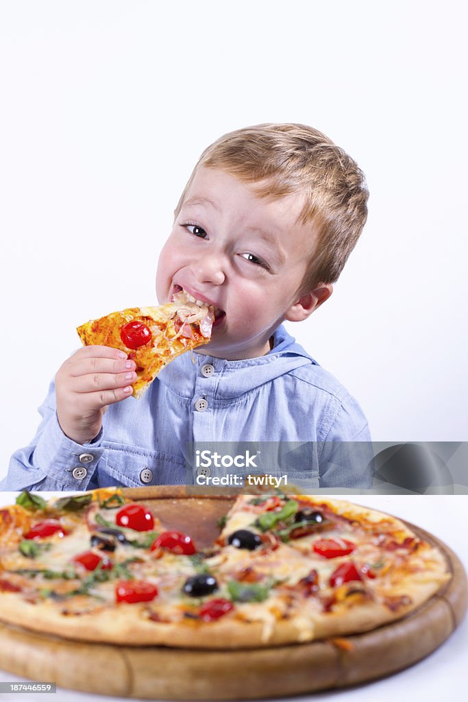 Little boy with pizza - Foto de stock de 4-5 años libre de derechos