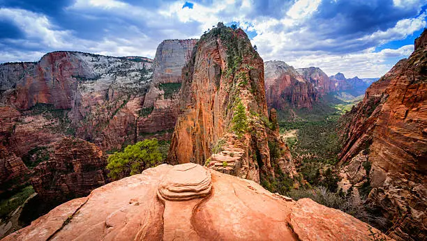 The final precarious section of the hiking trail to Angels Landing in Zion National Park, Utah. Angels Landing is at the top of the red sandstone cliffs in the centre of the picture and provides views of the whole of Zion Canyon.
