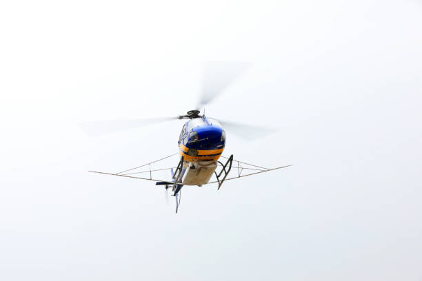 istock Agricultural helicopters fly in the sky 1874502097